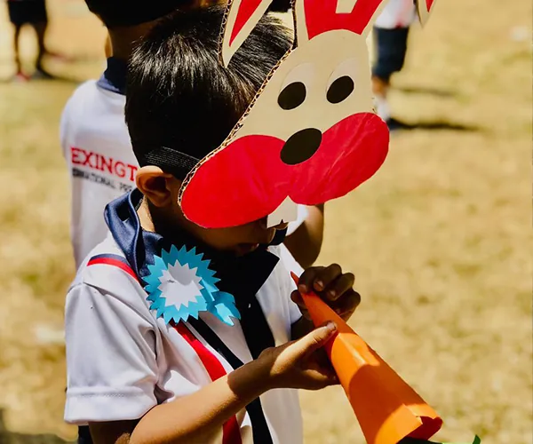 A Lexington child enjoying a colourful craft activity
